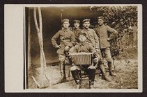 Five uniformed soldiers posing with accordion